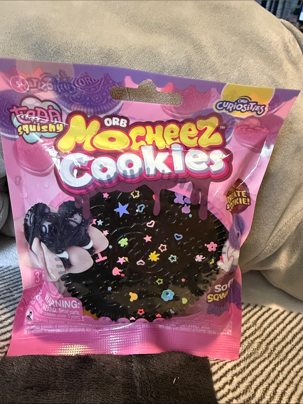 ORB Mocheez Cookies Squishy Toy - Pink Packaging. Black cookie